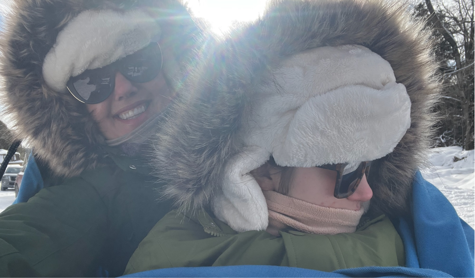 Ruby and her dad skiing